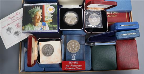 A collection of cased Royal Mint UK silver proof coins.
